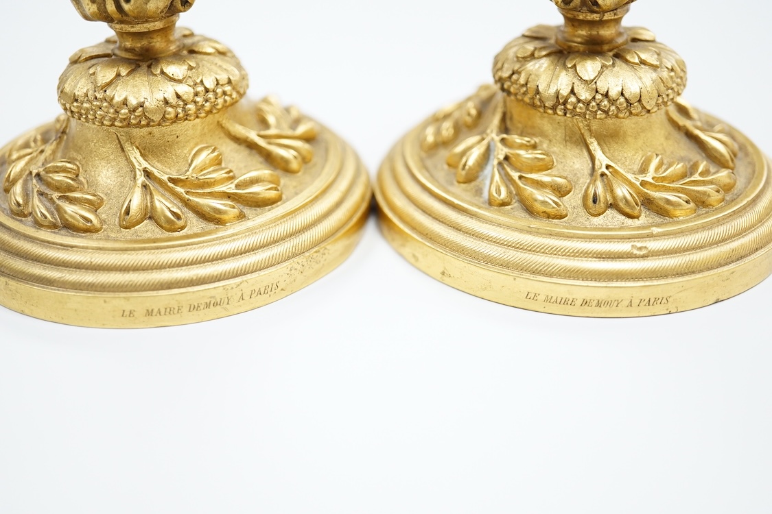 A pair of 19th century French ormolu candlesticks, stamped Le Maire Demouy a Paris 13cm high